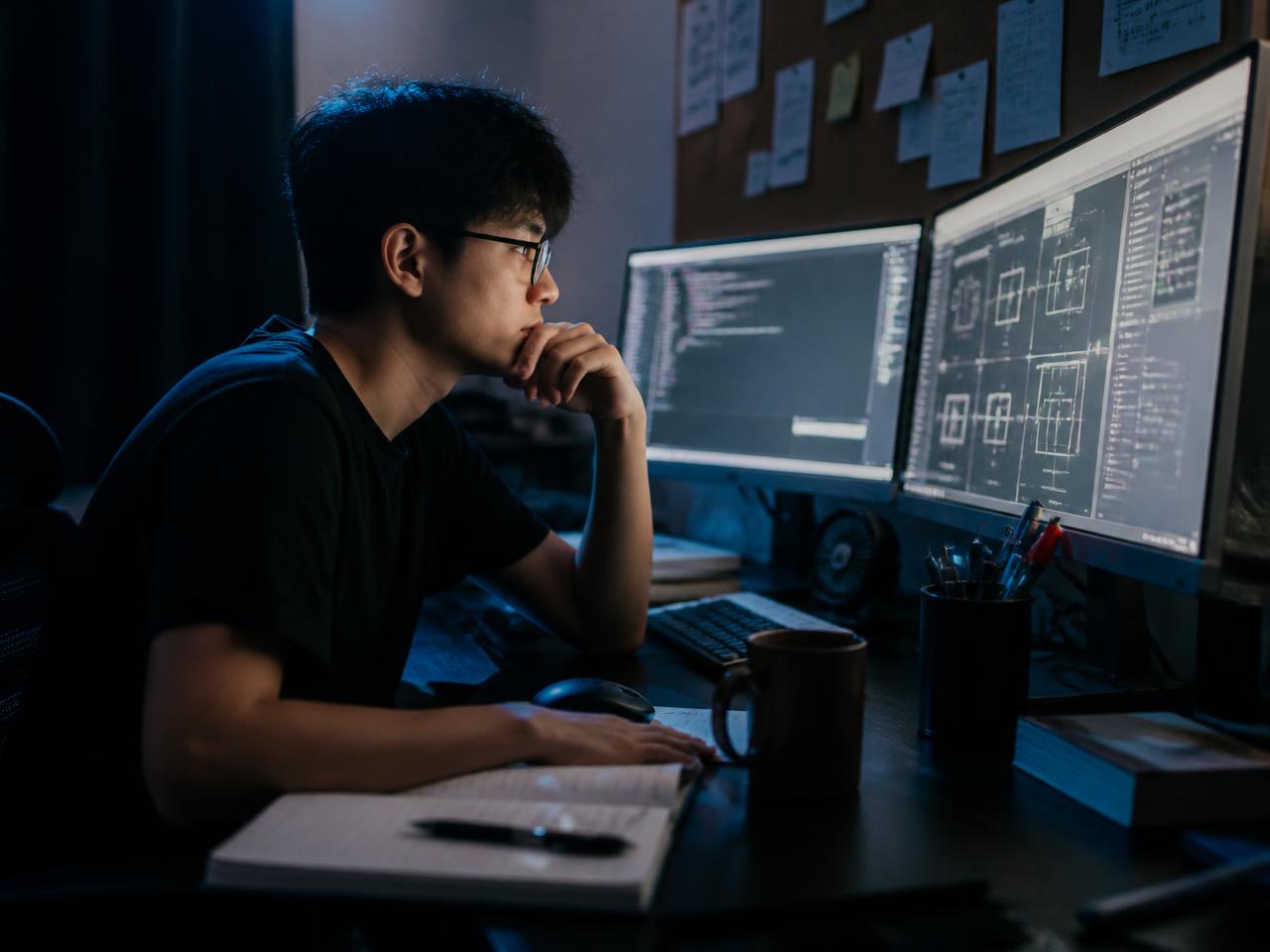 An innovator building a digital product at a glowing interface